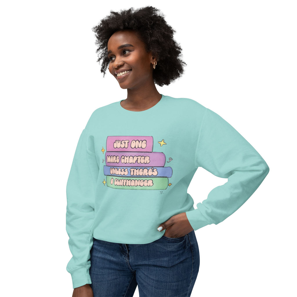Cozy Book Lover Crewneck Sweatshirt — "Just One More Chapter Unless There’s a Cliffhanger."