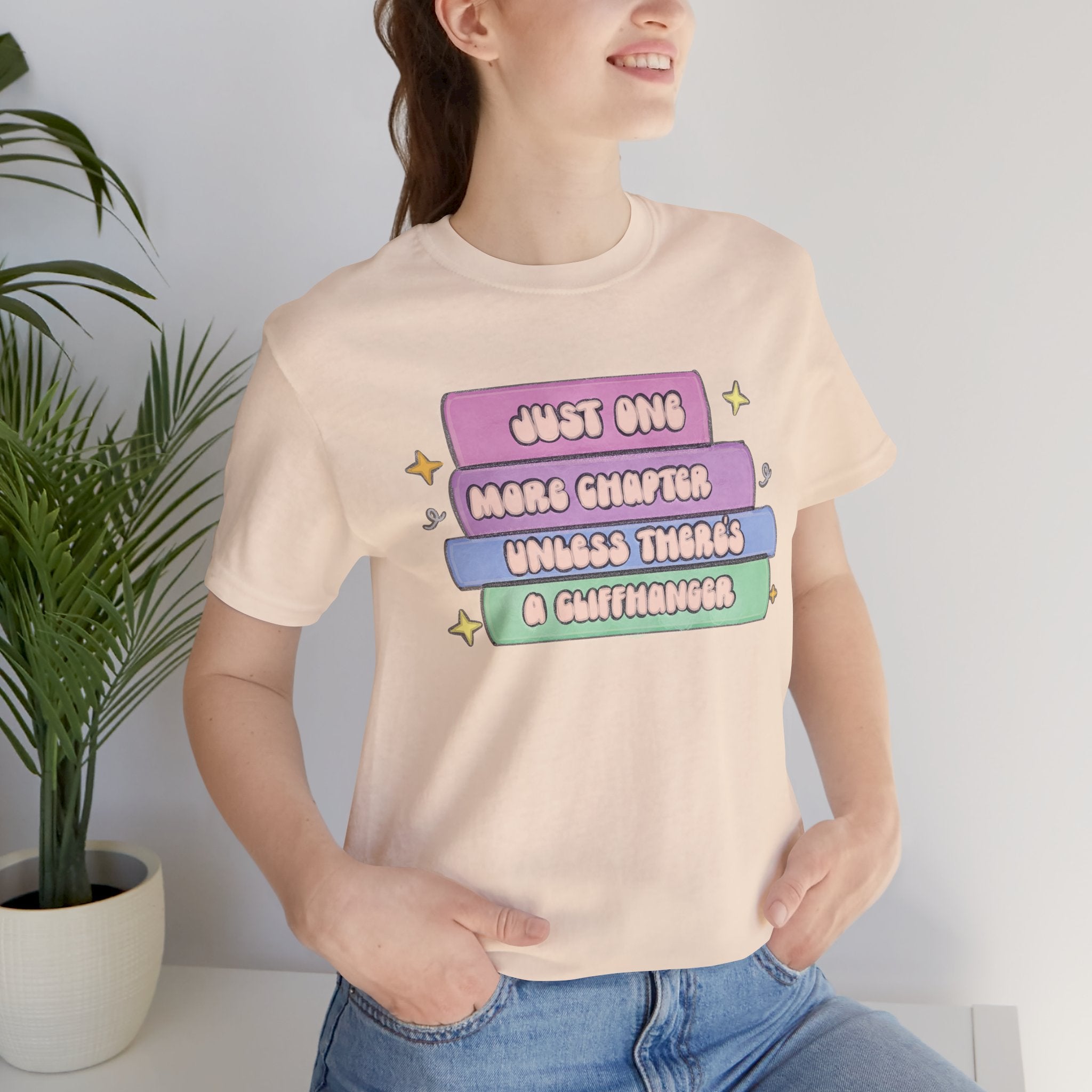 Book Lover Tee — "Just One More Chapter Unless There’s A Cliffhanger" Pastel Graphic